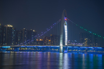 Fototapeta na wymiar the Pearl River with Liede Bridge illuminated at night in Guangzhou, China