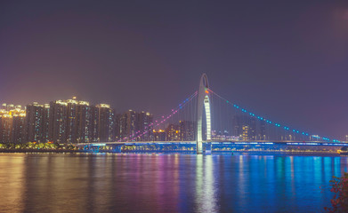 the Pearl River with Liede Bridge illuminated at night in Guangzhou, China
