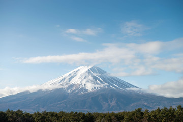 Close up top of beautiful Fuji mountain in morning with snow cover on the top with could, Japan