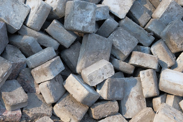 Stack of gray paving slabs. Paving tiles at construction site. Construction of sidewalks.