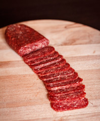 sliced salami on chopping board