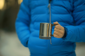 tourist in the winter forest / the guy travels against the backdrop of a winter landscape with forest, snow and trees