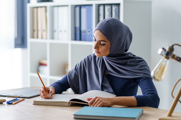 Female Muslim professor taking