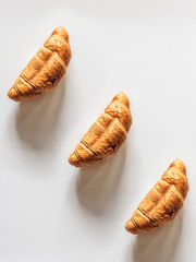 Croissants on a white background top view