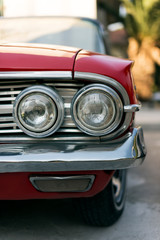 Front view of a red colored 1960 Chevrolet Impala.