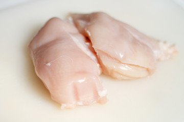Fototapeta premium raw chicken fillet on light background