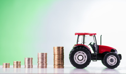 Metal coin stacks and tractor, money spool concept
