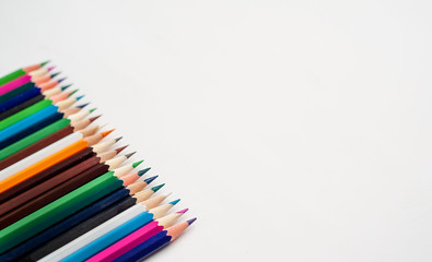 Colored pencils on a white background, with space for your text, blank for banner