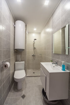 Clean bright stylish designer modern bathroom. Bathroom interior in luxury home with shower