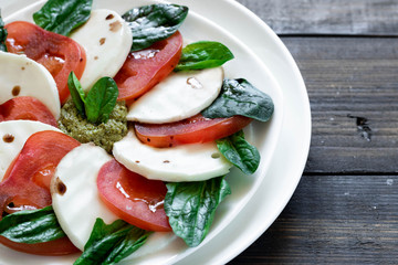 Caprese salad with pesto and balsamic vinegar