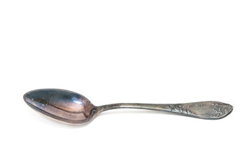 Antique spoon with ornament on white isolated background