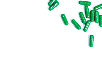 A scattering of pills on a white isolated background