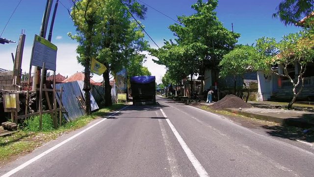 Nusa Dua, Bali / Indonesia-01 20 2019: Hyperlapse1 on Bali road, camera mounted on car