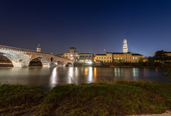 Fototapeta premium Ponte Pietra and Adige River at night - Verona Italy