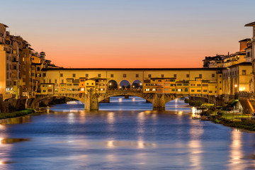 Sunset Ponte Vecchio - A close-up sunset view of the Ponte Vecchio "Old Bridge" over Arno River in Florence, Italy.