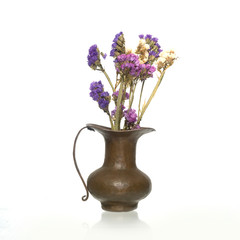 Brass vase with dry flowers isolated on white background