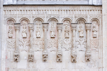 Exterior architectural decorations  St. Demetrius Cathedral, Vladimir, Russia. White stone carving on south wall of the church. Arcature belt