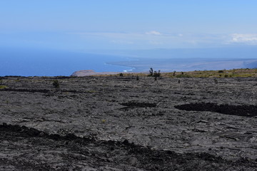 Old Lava field running into the sea sharp cliffs eroded over time from the crash of the surf