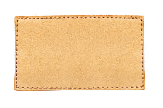 Brown stitched leather seam frame label tag isolated on white. Empty copy space fashion background.