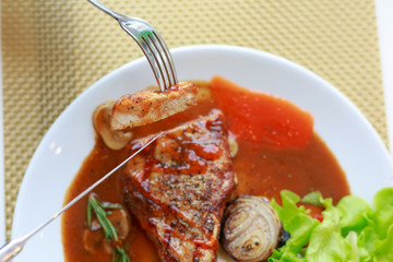 grilled pork chop with vegetable on disk