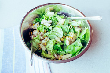 Salad with fried chicken, sweet corn and pasta