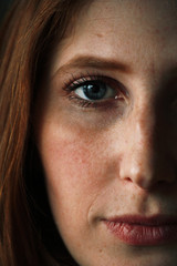 portrait of red-haired girl with freckles