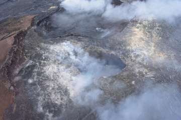Arial View of Mauna Loa Volcano Crater Hawaii smoke rising from the crater as it is errupting