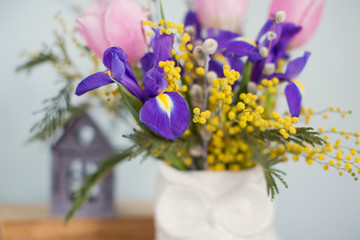 bouquet of tulips, iris, pussy willow and mimosa