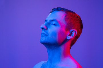 portrait of a man in multicolored light