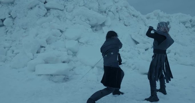 Furious fight between medieval warrior and warlock