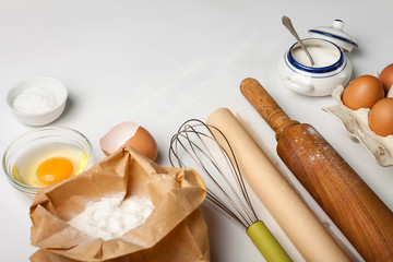 Kitchen tools and ingredients for cake or cookies.