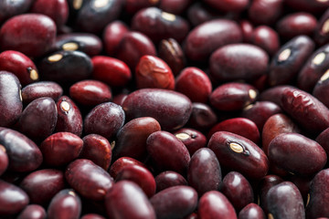 Closeup of a grain of red bean seeds. The texture of the legumes. Close up red beans background, seeds of red beans