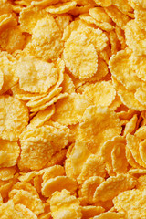 Golden cornflakes background and texture. View from above. cornflakes healthy breakfast. Close-up. macro