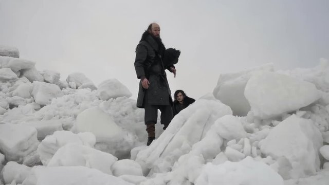 Medieval warriors making their way through glaciers