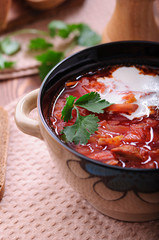 Aromatic soup with sour cream and black bread.