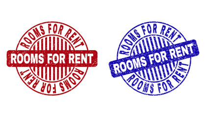 Grunge ROOMS FOR RENT round watermarks isolated on a white background. Round seals with grunge texture in red and blue colors.