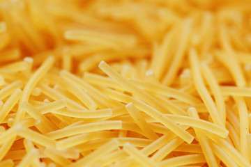 Background texture and pattern of boiled egg noodles or spaghetti pasta in full-frame format. View from above. Close-up
