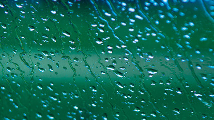 Rain Drops Relecting on Window Glass
