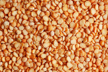 Background texture of pea porridge golden color in full-frame form. View from above. Close-up