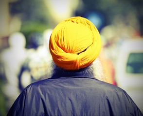 sikh man with yellow turban and long beard