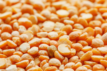 Background texture of pea porridge golden color in full-frame form. View from above. Close-up