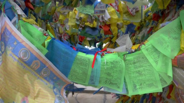 Colorful Tibetan prayer flags swaying in the wind in the temple, Ulan Ude Russia