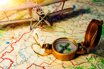 Fototapeta na wymiar model aircraft, travel compass, a map. travel, rest.