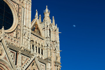 Fototapeta na wymiar Siena’s cathedral facade detail. Medieval church famous landmark in Tuscany, Italy