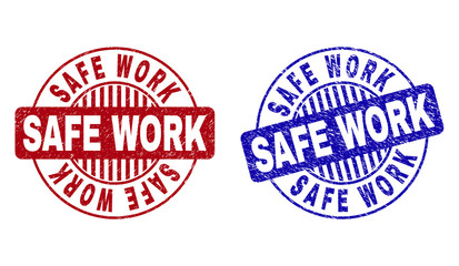 Grunge SAFE WORK round stamp seals isolated on a white background. Round seals with grunge texture in red and blue colors. Vector rubber overlay of SAFE WORK title inside circle form with stripes.