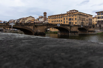 Riverside skyline view in Firenze, Italy on a cloudy day