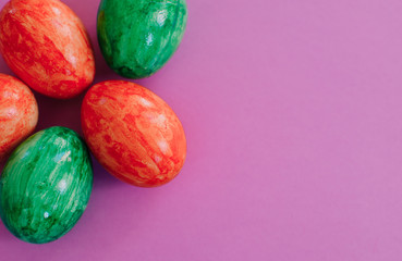 Easter eggs on violet background.