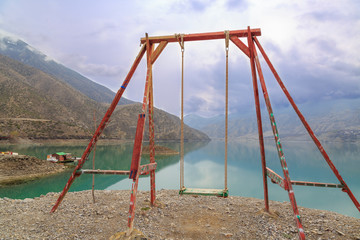 Fototapeta premium Swing with tortum lake view in Uzundere, Erzurum, Turkey