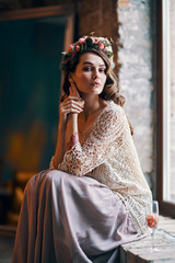 Beautiful confident woman portrait relax and sitting on window sill