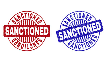 Grunge SANCTIONED round stamp seals isolated on a white background. Round seals with grunge texture in red and blue colors. Vector rubber imprint of SANCTIONED title inside circle form with stripes.